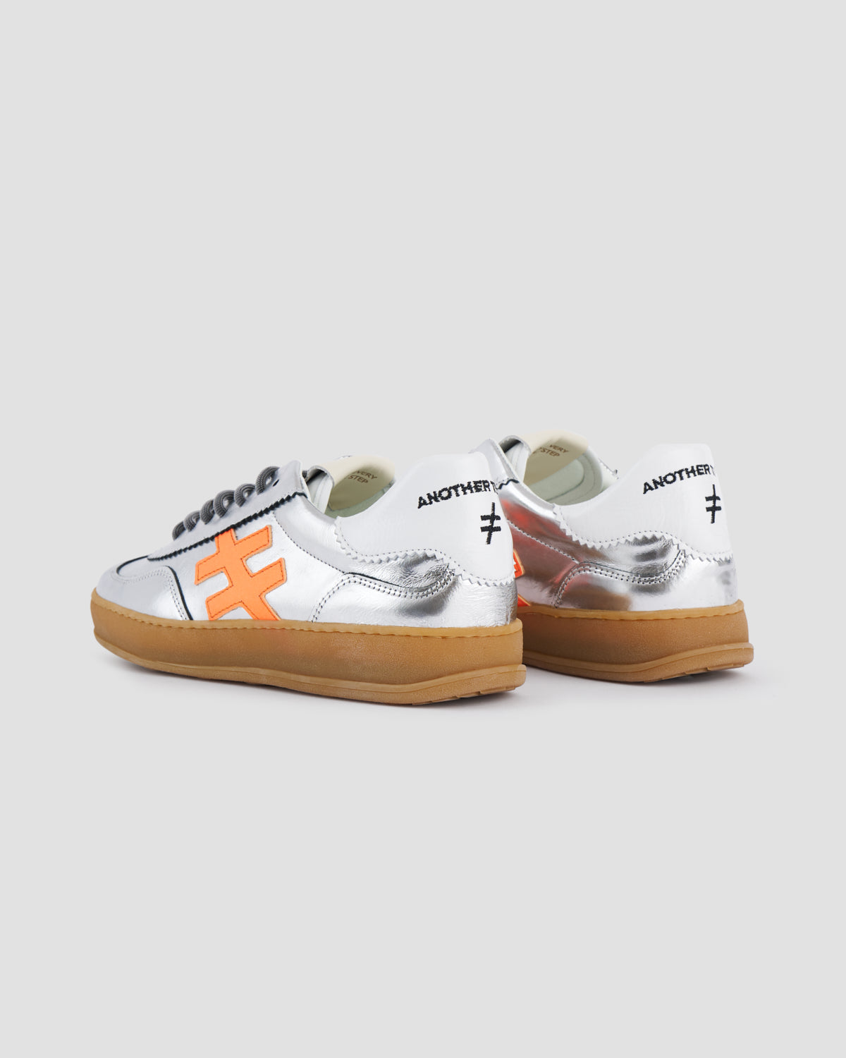 Another Trend A0325841 Metallic Trainers with White Back & Orange Logo