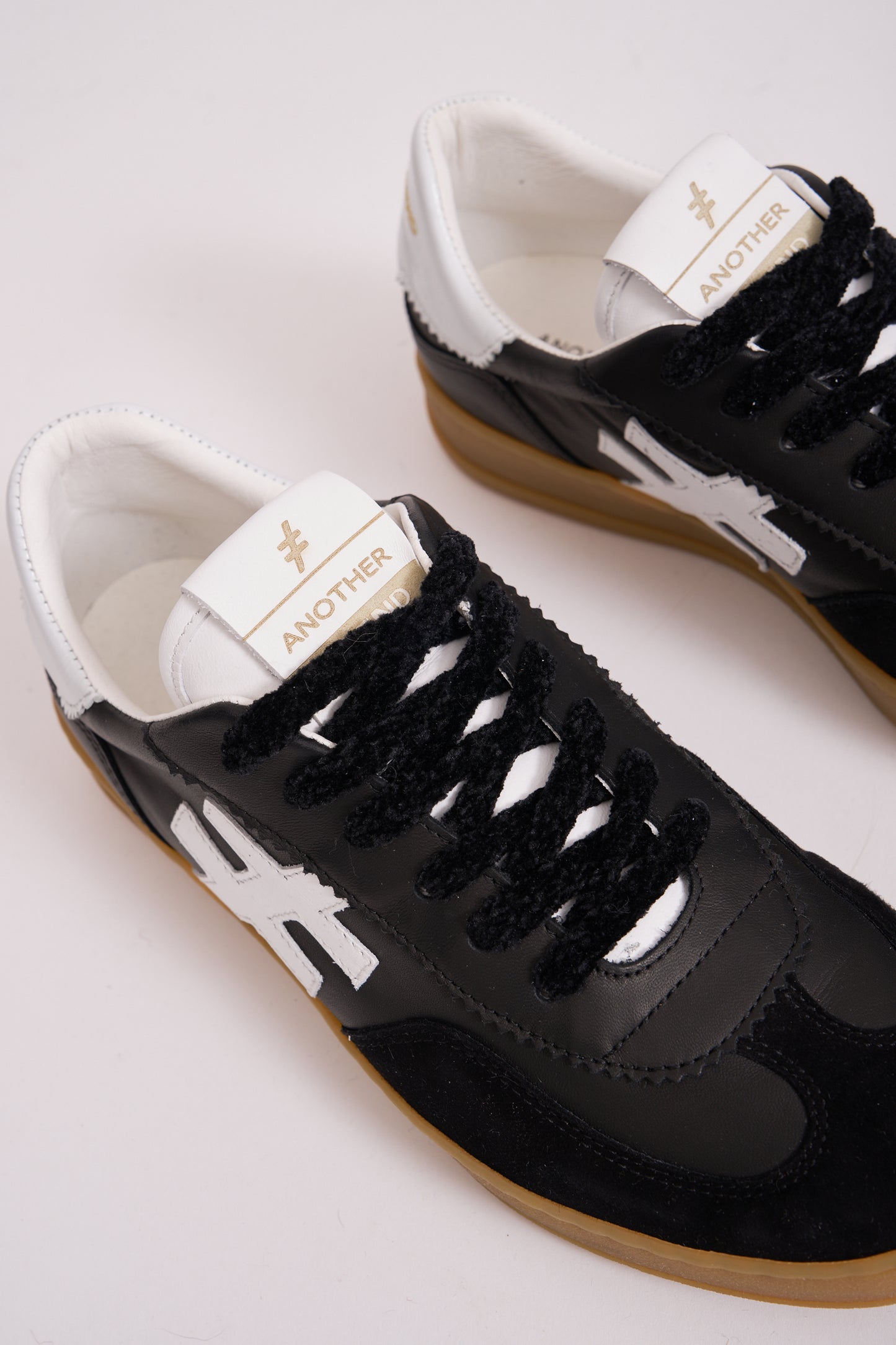 Another Trend A032V205 Black Trainers with White Heel & Logo