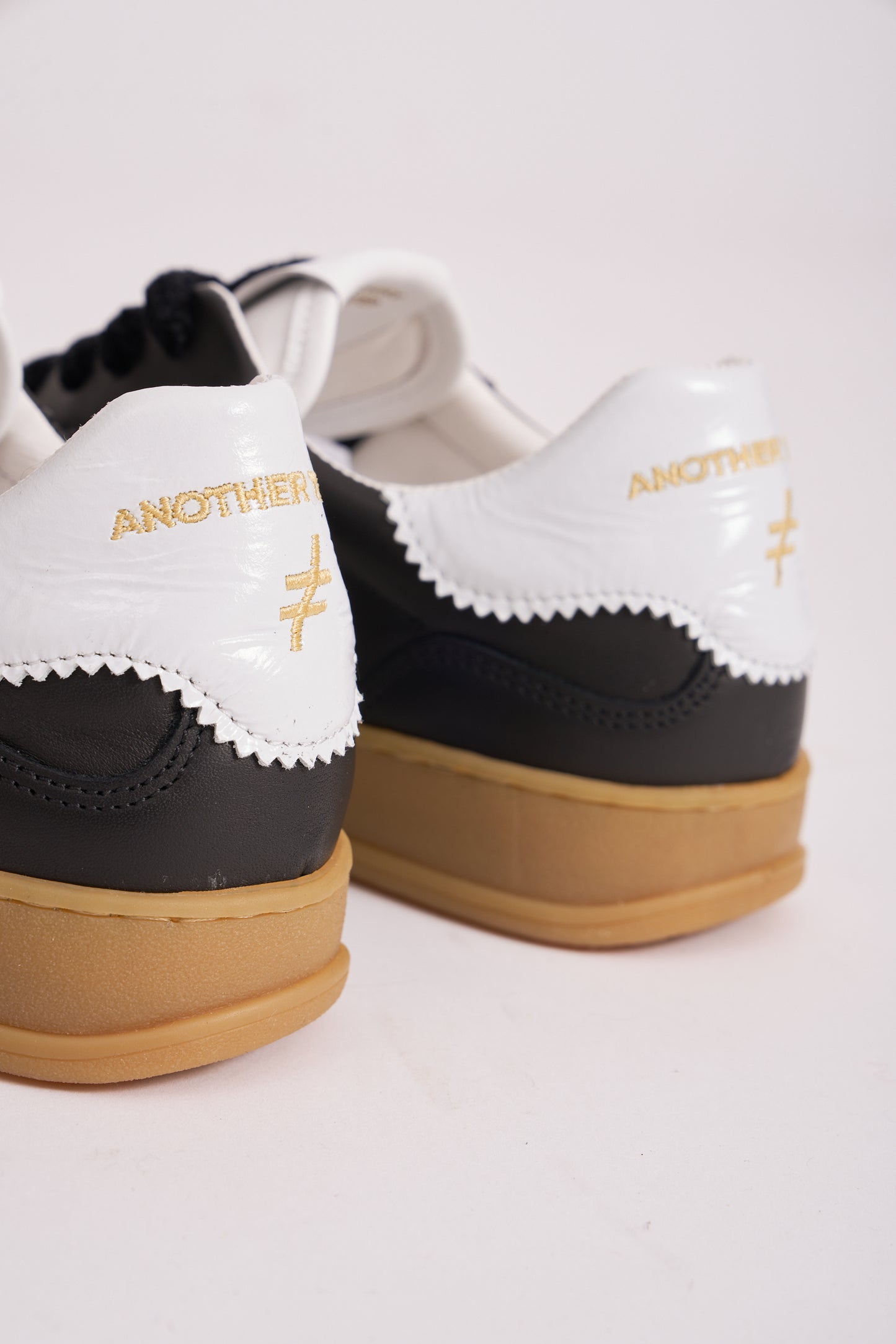 Another Trend A032V205 Black Trainers with White Heel & Logo