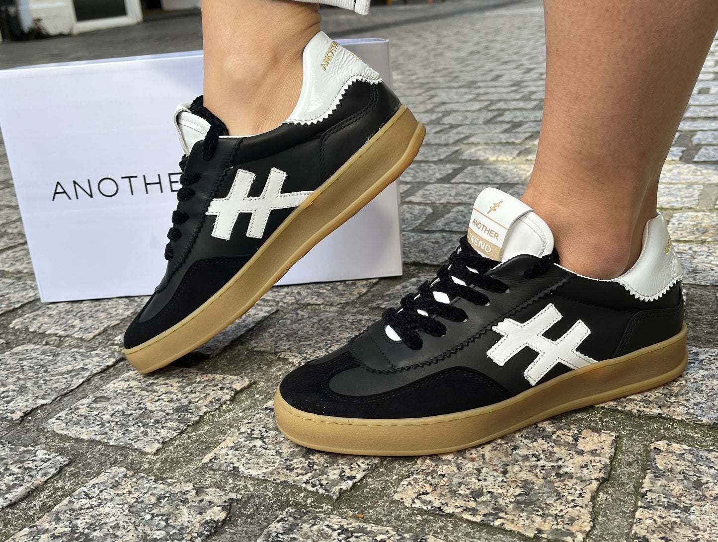 Another Trend A032V205 Black Trainers with White Heel & Logo