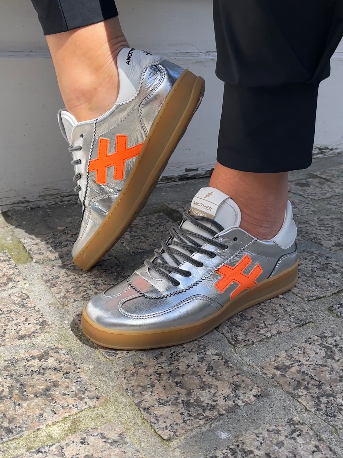 Another Trend A0325841 Metallic Trainers with White Back & Orange Logo