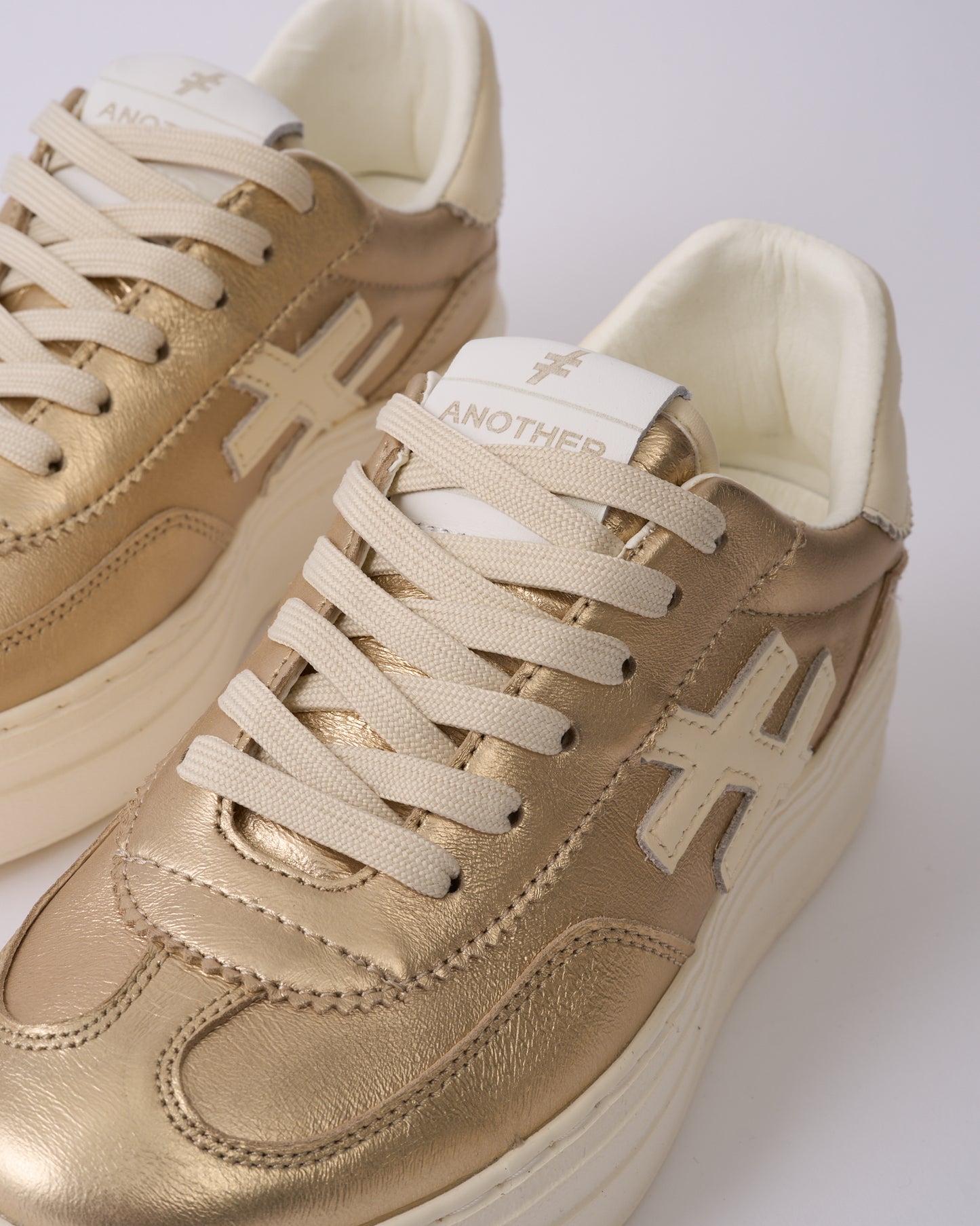 Another Trend A0352643 Platino Gold & Cream Trim Thick Sole Trainers