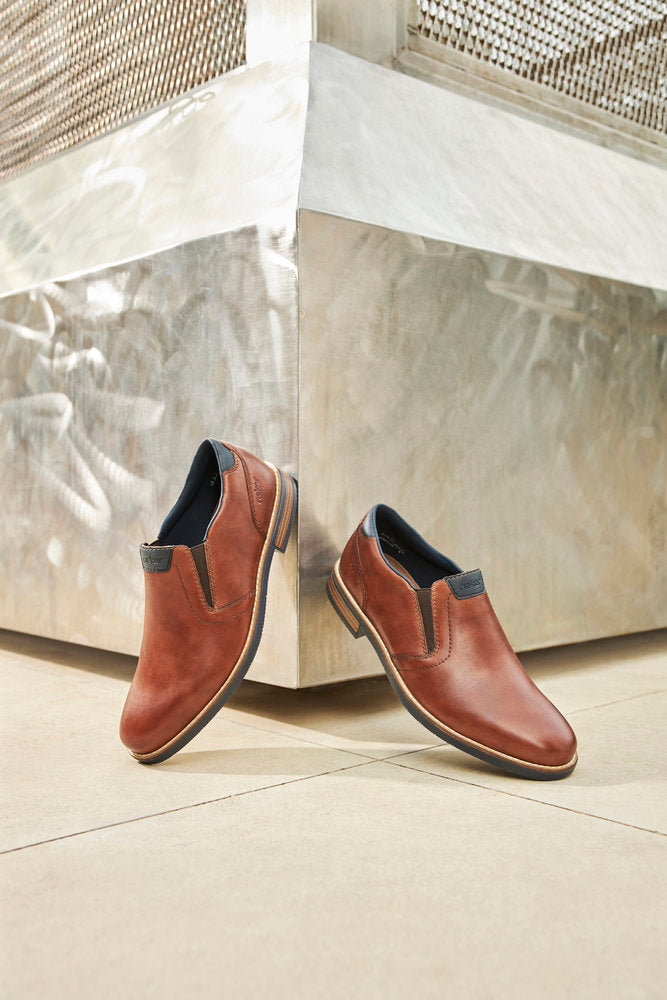 Rieker 13557-24 Tan Brown Slip On Shoes with Navy Trim