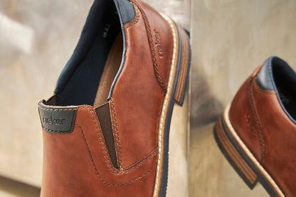Rieker 13557-24 Tan Brown Slip On Shoes with Navy Trim