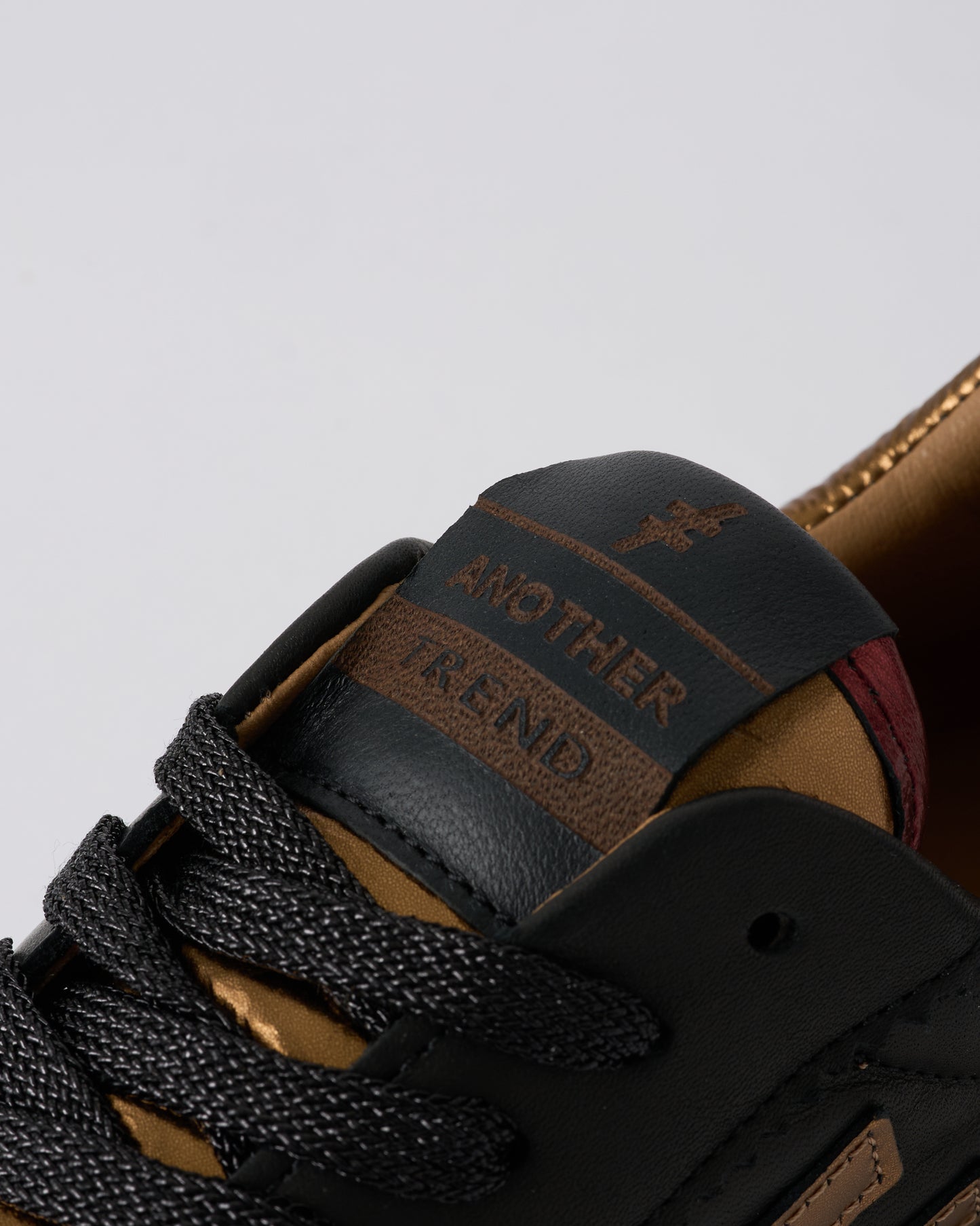 Another Trend A0320385 Komba Black & Dark Gold Trainers